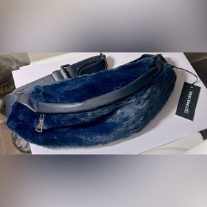 Faux fur adjustable waist pouch.